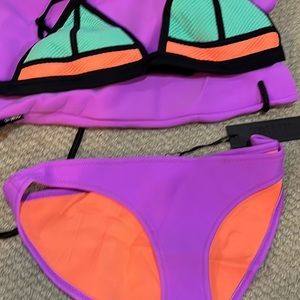 Triangl swimwear New With Tags. Top is a L and bottom is a M. Comes with bag.
